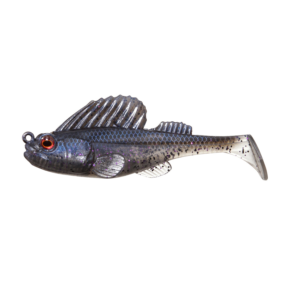 The Megabass Dark Sleeper Swimbait by Megabass is a soft plastic lure shaped like a small fish with black fins, grayish body, black spots, and red eye. It features lifelike paddle-tail action and a mouth hook ring for bottom-bouncing performance.