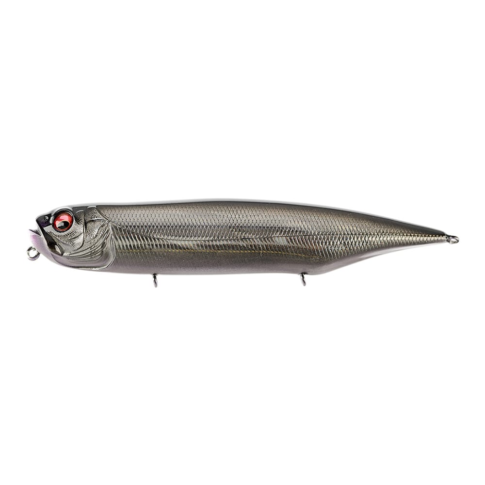 The Megabass Dog-X Diamante Rattle by Megabass is a metallic gray topwater lure shaped like a small fish, featuring detailed scales, red and black eyes, and hooks for highly effective walking action.