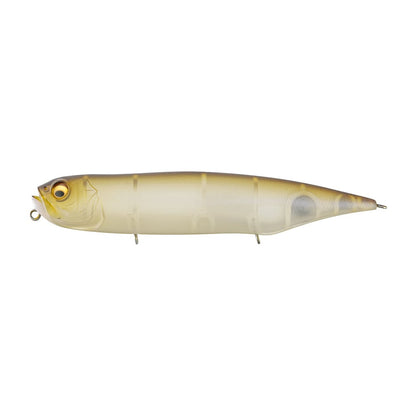 The Megabass Dog-X Diamante Rattle by Megabass is a topwater lure shaped like a small fish, featuring a yellowish-brown gradient top, translucent body, large eyes, and metal loops—designed for enticing strikes with its lifelike walking action.