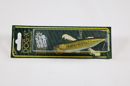 The Megabass Dog-X Quick Walker is a lifelike pencil bait fishing lure with green and yellow coloring, one-knock sound, and comes in green and black branded packaging featuring product details.
