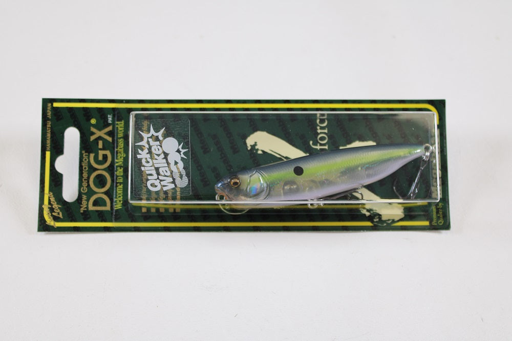 A packaged Megabass Dog-X Quick Walker pencil bait fishing lure, featuring a green-yellow design and "Quick Walker" label, is displayed against a white background. The unique one-knock sound lure is visible through a clear plastic cover.
