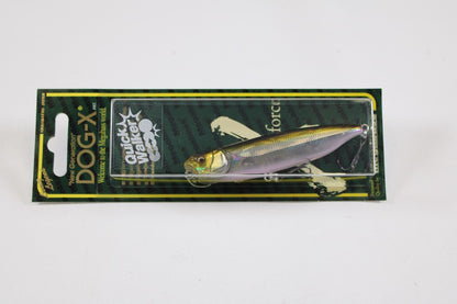 The Megabass Dog-X Quick Walker, by Megabass, is a pencil bait with a lifelike fish design in metallic yellow and silver, packaged on a green and black backing. This lure is noted for its enticing one-knock sound.