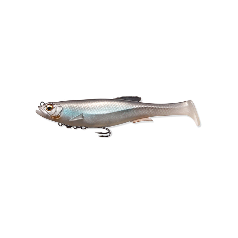 The Megabass Magdraft Swimbait 5in is a lifelike fish-shaped lure with a silver body, blue iridescence, and black fin. It features a detailed eye and sharp treble hook secured by the MAG-HOLD System for enticing head-shaking action, displayed on a white background to attract your next catch.
