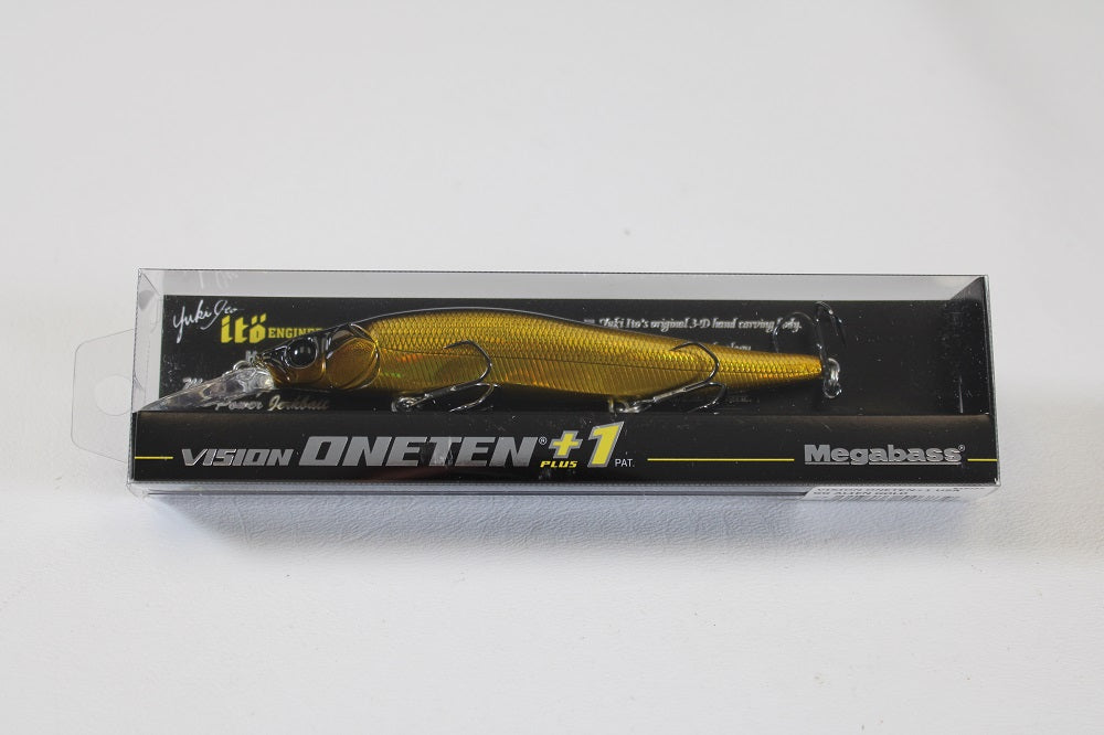 The Megabass ITO Vision 110+1 (SP-C) Alien Gold jerkbait is showcased in a clear plastic box with black and yellow branding—ideal for anglers seeking long-bill minnow performance.
