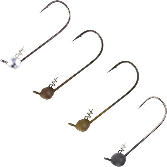 Four Owner Shaky Ultraheads jig heads, each with a different colored weighted head, are arranged diagonally on a white background. Featuring coil spring bait holders, they're perfect for finesse baits and weedless Texas Rig'n. Brand: Owner.