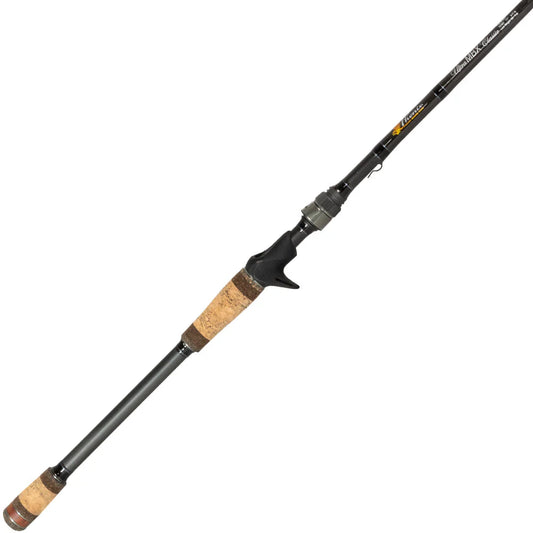 The Phenix Ultra MBX Casting Rod 7'3" Extra Heavy (PHX-UMBXCL-C703XH), made from Toray T40 Carbon Fiber with a cork handle and trigger grip, is shown upright on a white background.