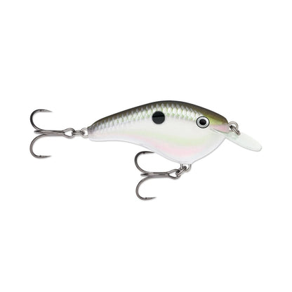 The Rapala OG Slim 6 Crankbait by Rapala is a realistic, fish-shaped bass lure with two treble hooks, a white and gray scaled body, translucent plastic lip, and a black dot near the fin.