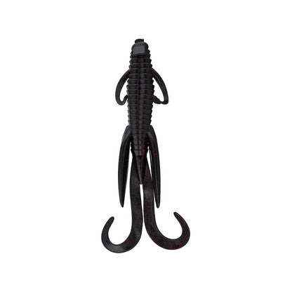 The Reaction Innovations Man Bear Pig is a soft plastic creature bait in black with red speckles, ribbed body, short side appendages, and long curly tails—ideal for flipping into heavy cover.
