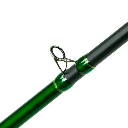 Close-up of the Shimano Compre Muskie Telescopic Casting Rod 9'0" Heavy (CPCM90HTJ) by Shimano, highlighting the guide ring and rod shaft with metallic finishes and black accents.