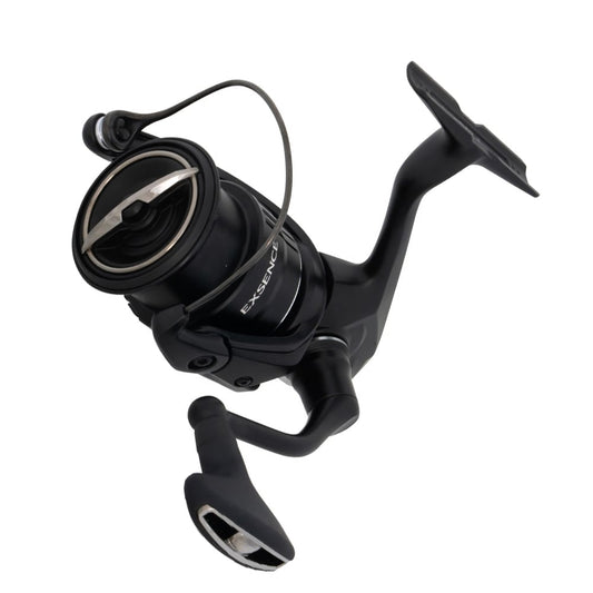 The Shimano Exsence Spinning Reel 4000MXGA 6.2:1 (EXS4000MXGA) in black with silver details is shown angled on a white background, displaying the "EXSENCE" label and advanced MGL Rotor technology.