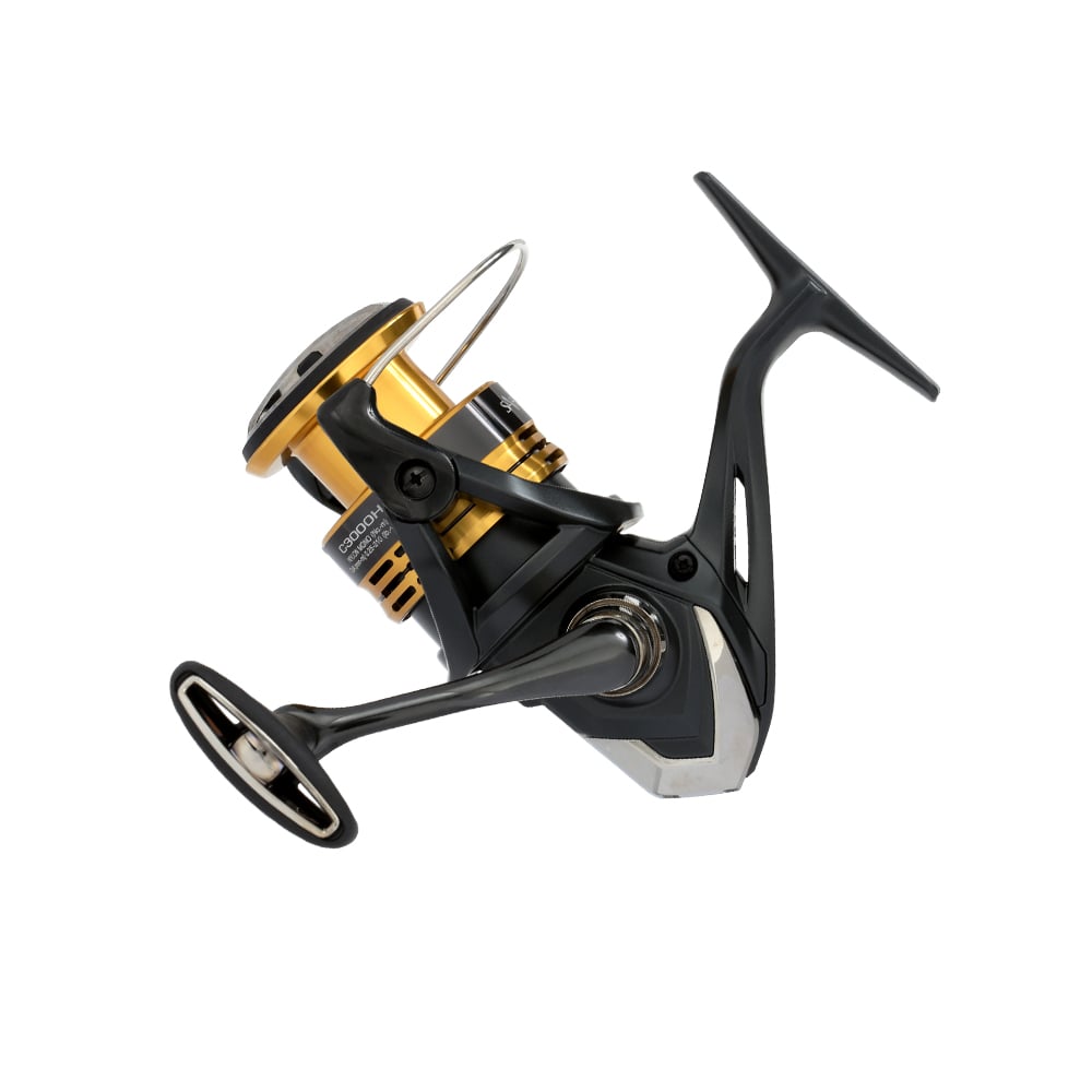 The Shimano Sahara FJ Spinning Reel 3000HGFJ (SHC3000HGFJ) by Shimano, in black and gold, features HAGANE Gear, a handle, spool, and metallic accents with a modern design, shown isolated on a white background.