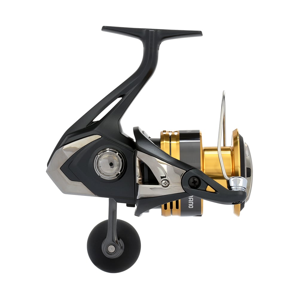 The Shimano Sahara FJ Spinning Reel 5000XGFJ features a sleek black and metallic design, a large spool with a gold accent, and an ergonomic handle. Its HAGANE Gear technology enhances durability and style against a plain white background.
