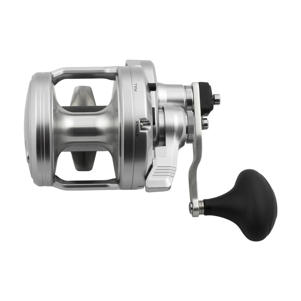 The Shimano SpeedMaster 20II 5.2:1/2.3:1 SPM20II, a silver conventional reel with large handle and black grip, features a durable HAGANE Body and is shown from the side against a white background.