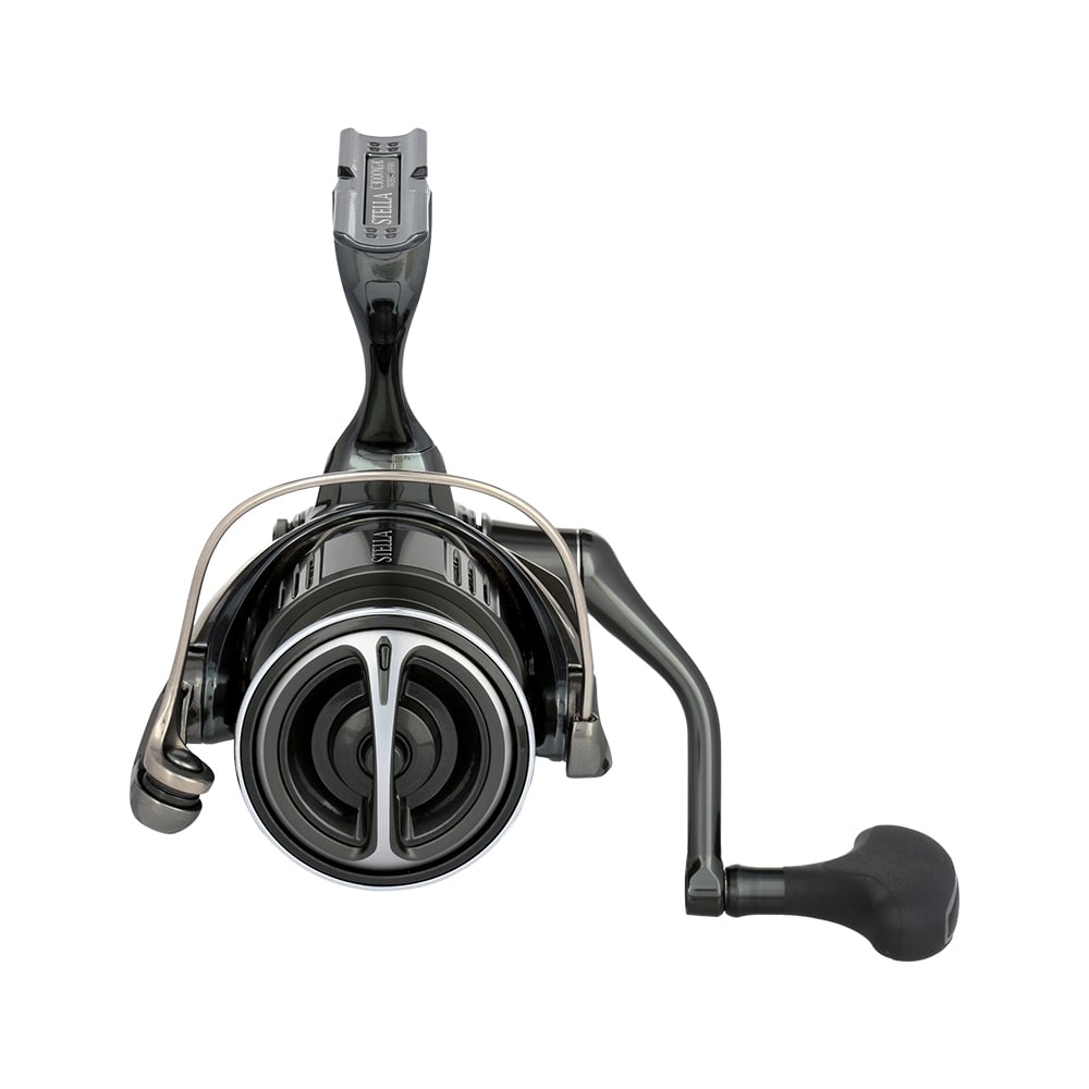 The Shimano Stella FK Spinning Reel 3000XGFK by Shimano, model STLC3000XGFK, features a metal bail arm, ergonomic handle, and InfinityDrive, shown from the front on a white background.
