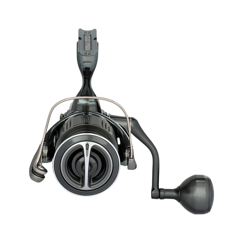 A close-up front view of the Shimano Stella FK Spinning Reel 5000XGFK by Shimano, featuring a black design, metal bail arm, right-side round handle, and advanced reel technology, displayed against a white background.