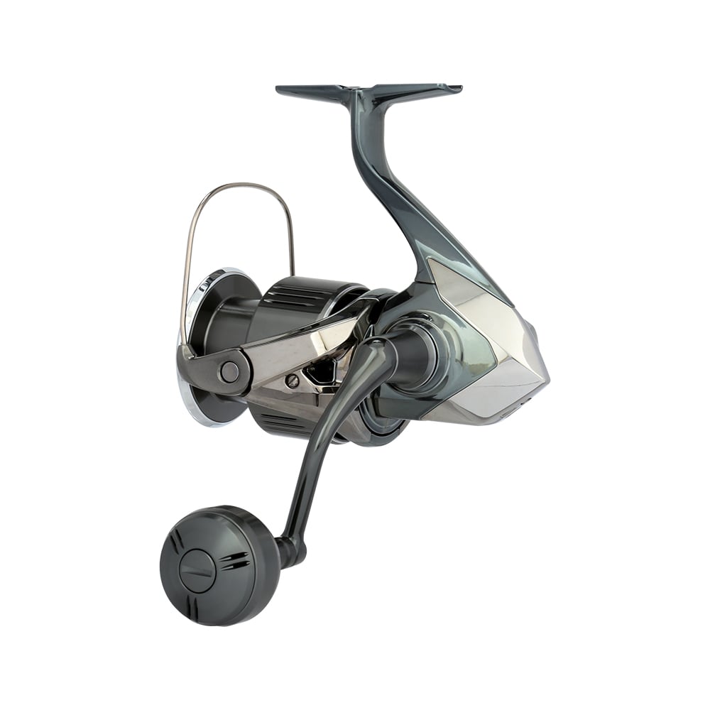 The Shimano Stella FK Spinning Reel 5000XGFK by Shimano features a metallic finish, large handle, wire bail arm, and sleek angular design—highlighting advanced Shimano reel technology, shown isolated on a white background.