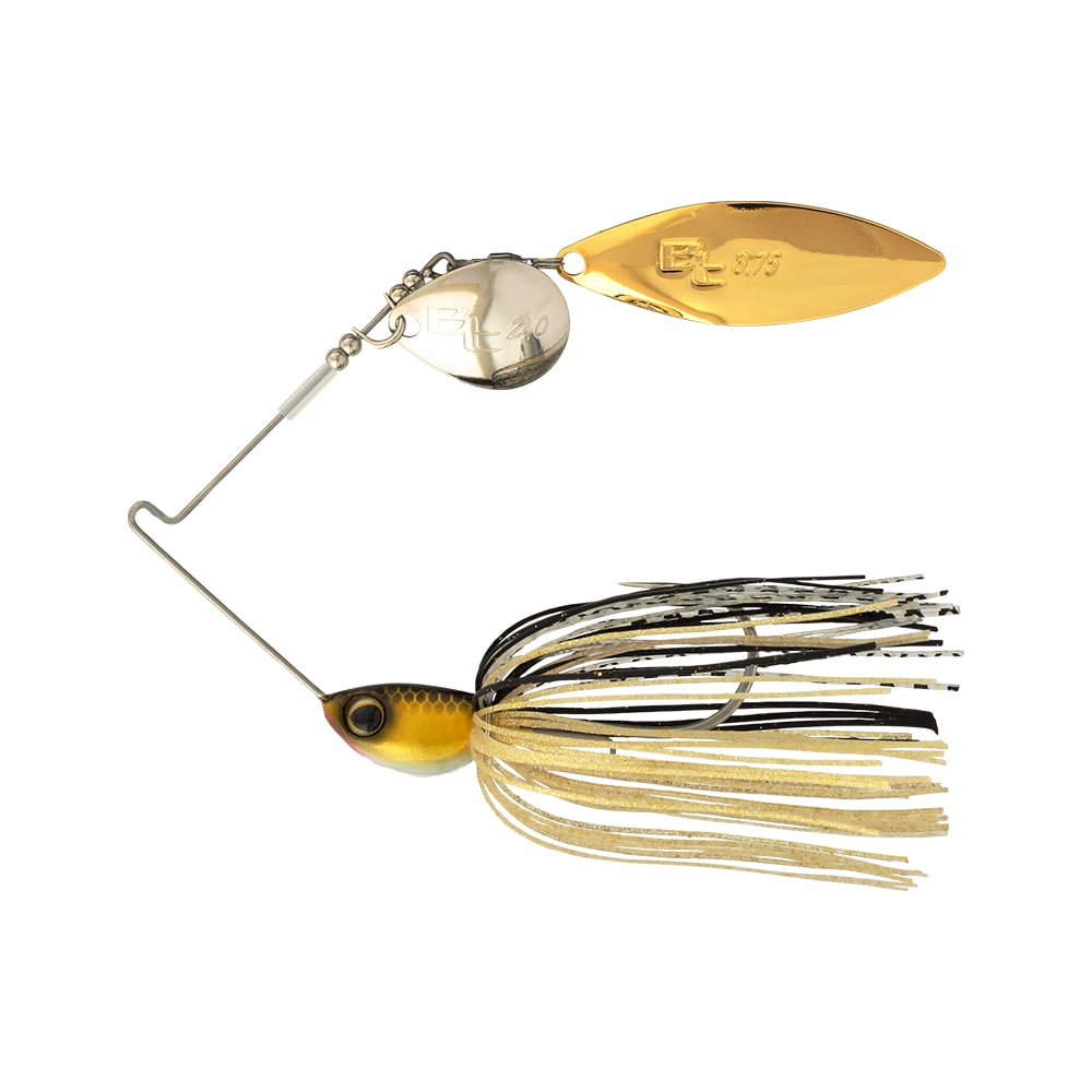 The Shimano Swagy Spinnerbait Colorado Willow by Shimano features gold and silver blades, a yellow and black fish-shaped head, a tapered-wire design for strong vibration, and a skirt with beige, black, and white strands.