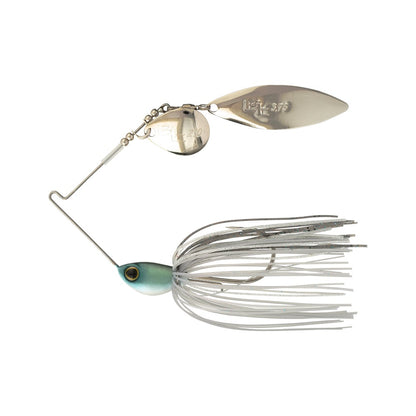 The Shimano Swagy Spinnerbait Colorado Willow is a silver and white lure with a fish-shaped head, realistic eye, tapered-wire design for vibration, two spinning blades, and a skirt of white and silver strands.