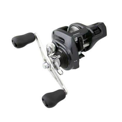 The Shimano Tekota 300HGLCA 6.6:1 Line Counter Casting Reel (TEK300HGLCA) by Shimano features a black and silver finish, dual black rubber handles, spool, and adjustment knobs, displayed against a white background.