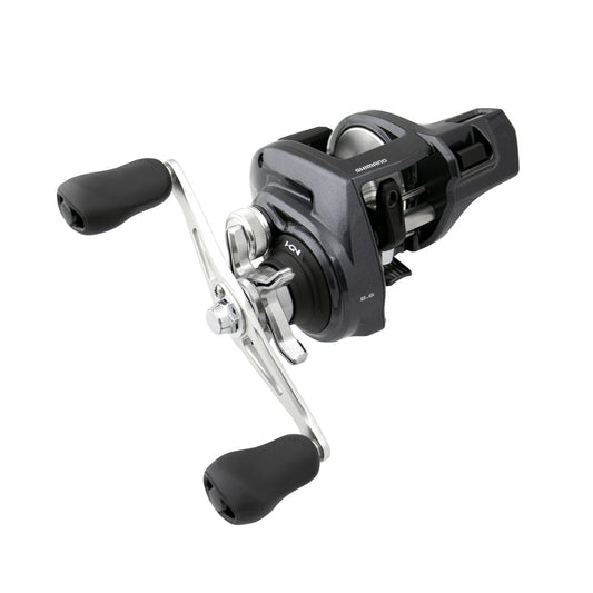 The Shimano Tekota 300HGLCA 6.6:1 Line Counter Casting Reel (TEK300HGLCA) by Shimano features a black and silver finish, dual black rubber handles, spool, and adjustment knobs, displayed against a white background.
