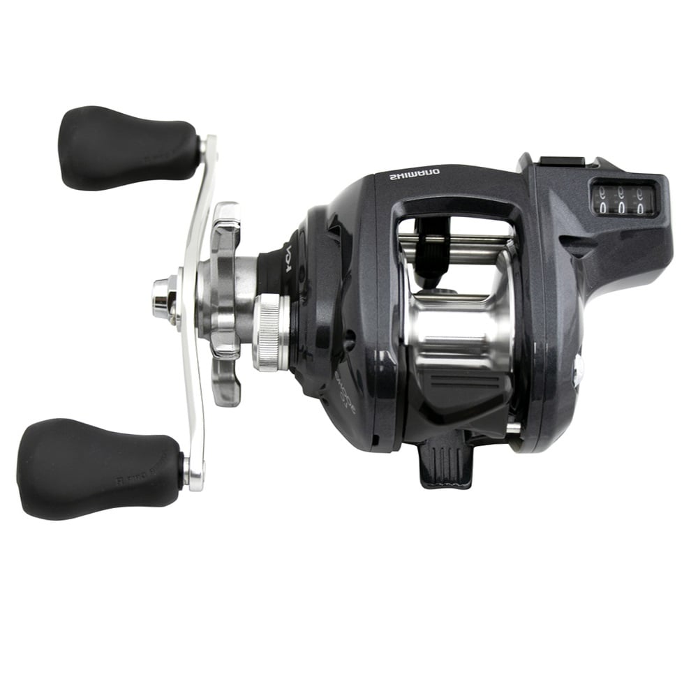 The Shimano Tekota 301HGLCA is a black and silver left hand casting reel with a line counter, two black rubber handles, visible spool, adjustable tension knob, and 6.6:1 gear ratio, viewed from above.