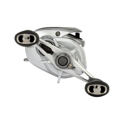 The Shimano Tranx 150A Casting Reel 6.3:1 Right Hand by Shimano, in silver and black with two handle grips, is designed for saltwater fishing and displayed against a white background.