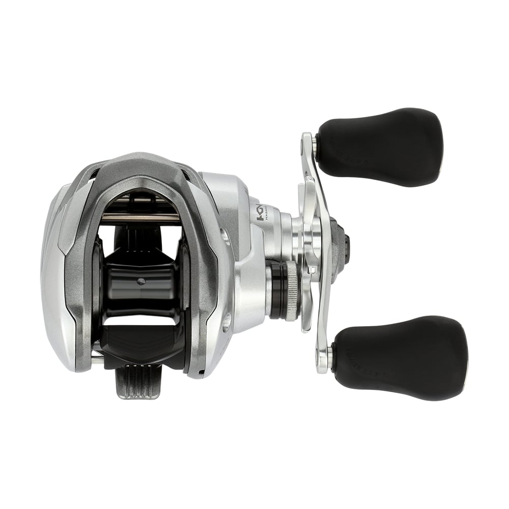 The Shimano Tranx 150A Casting Reel 6.3:1 Right Hand (TRX150A) features a sleek silver and black design with dual black padded handles, shown from above on a white background.
