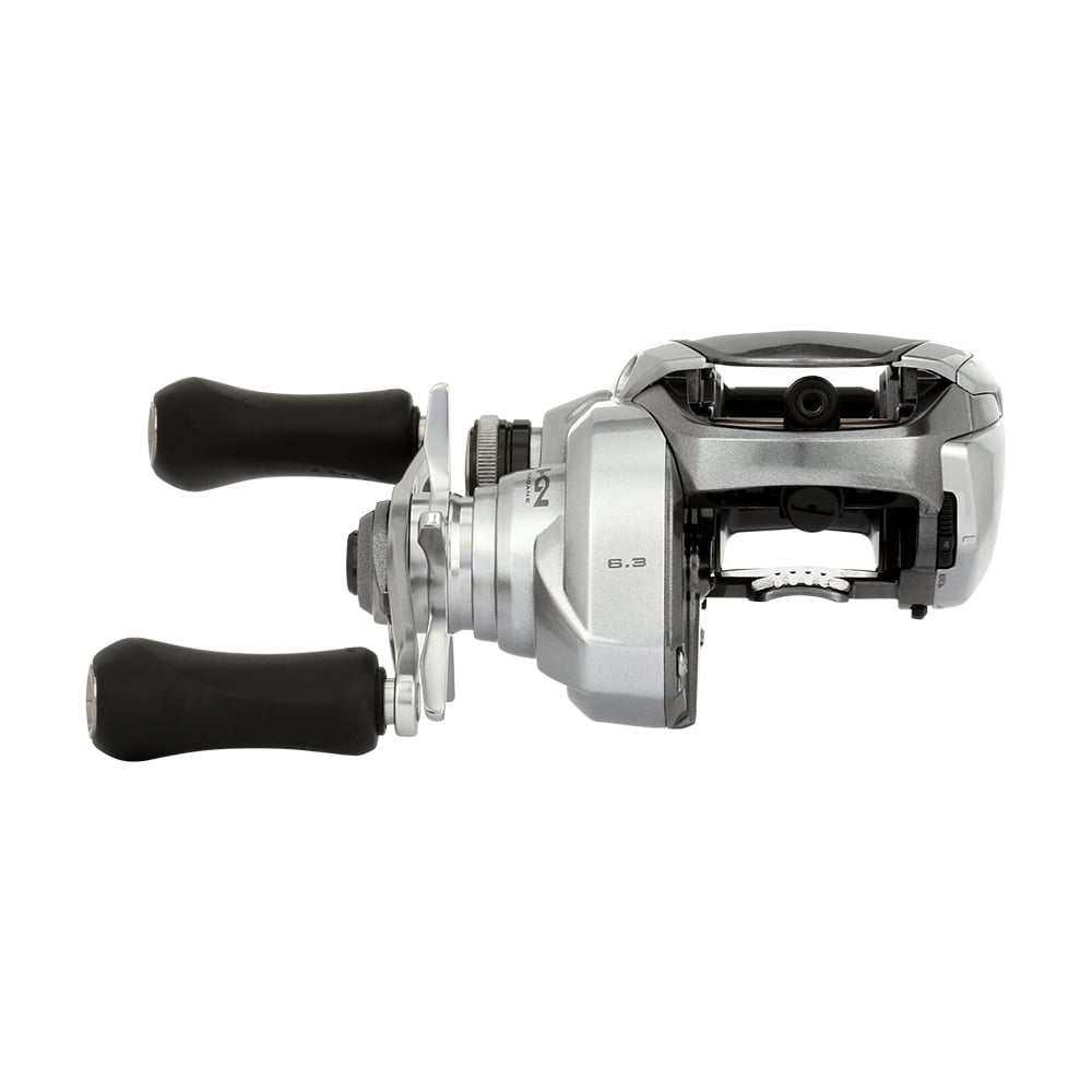 The Shimano Tranx 150A Casting Reel 6.3:1 Right Hand (TRX150A) by Shimano features a sleek silver design with two black handles, shown from the side on a white background—perfect for saltwater fishing.