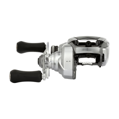 The Shimano Tranx 150A Casting Reel 6.3:1 Right Hand (TRX150A) by Shimano features a sleek silver design with two black handles, shown from the side on a white background—perfect for saltwater fishing.