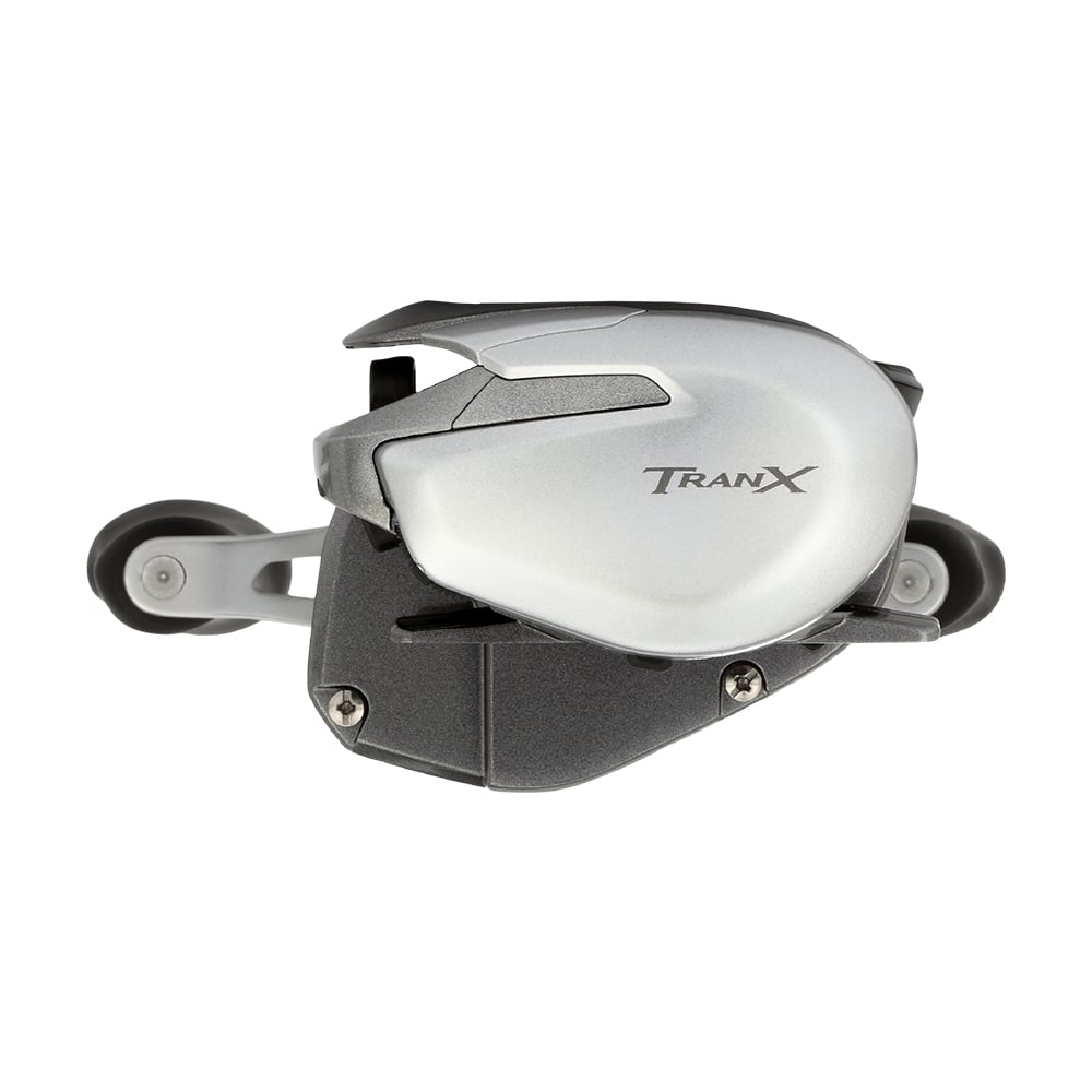 A Shimano Tranx 150A Casting Reel 7.2:1 Left Hand (TRX151HGA) in silver and black, shown from the side to highlight its compact build and sleek design—perfect for saltwater fishing—set against a white background.