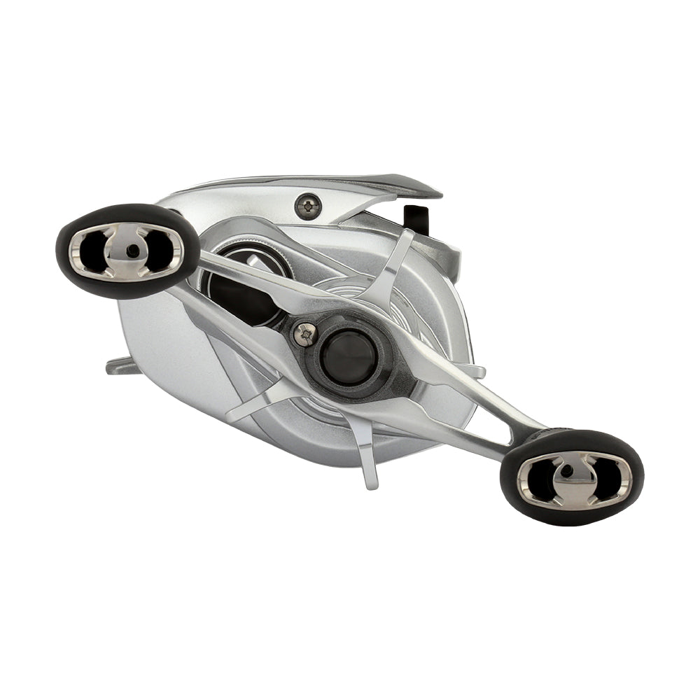 The Shimano Tranx 150A Casting Reel 7.2:1 Left Hand (TRX151HGA) by Shimano features a sleek silver finish, two black handles, and modern metallic accents—perfect for saltwater fishing. Viewed from the side against a white background.