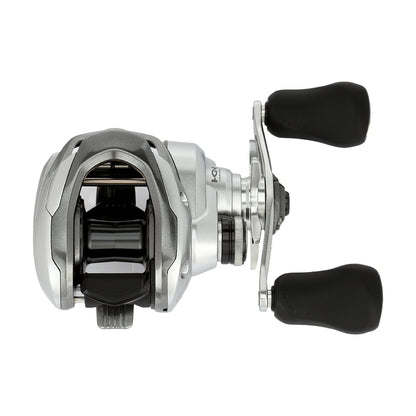 The Shimano Tranx 150A Casting Reel 7.2:1 Right Hand (TRX150HGA) features a silver and black design with two large black rubberized handles, shown from above on a white background—ideal for saltwater fishing.