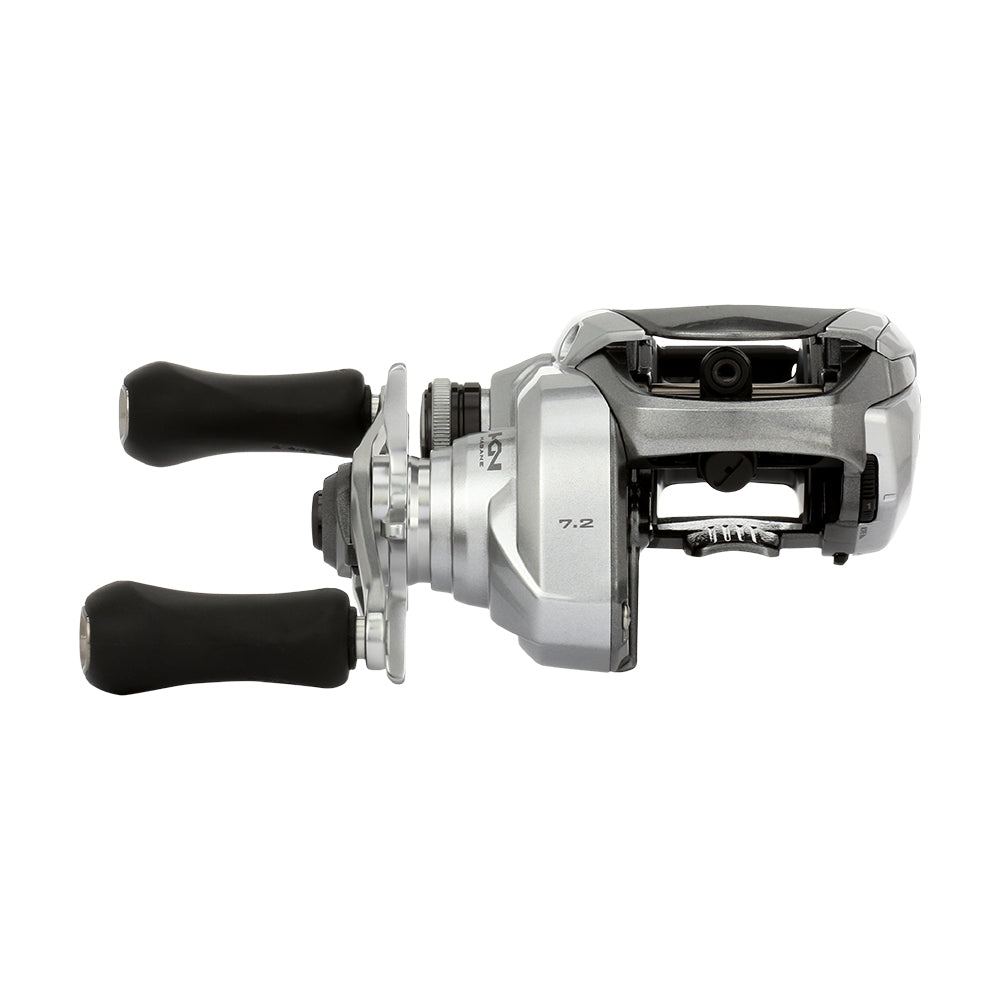 The Shimano Tranx 150A Casting Reel 7.2:1 Right Hand (TRX150HGA) features a silver and black design with two black handles, shown from the side on a white background—perfect for saltwater fishing.