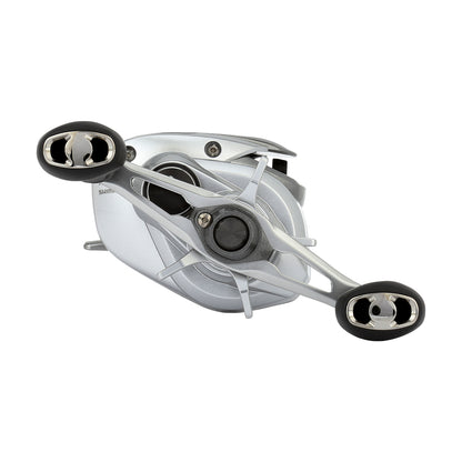 The Shimano Tranx 150A Casting Reel 8.2:1 Right Hand (TRX150XGA) by Shimano is shown in silver with dual black and silver handles from an angled side view against a white background—ideal for saltwater fishing.