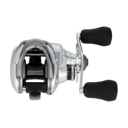 The Shimano Tranx 150A Casting Reel 8.2:1 Right Hand (TRX150XGA) by Shimano features a sleek silver and black look with dual black handles—perfect for precision saltwater fishing.