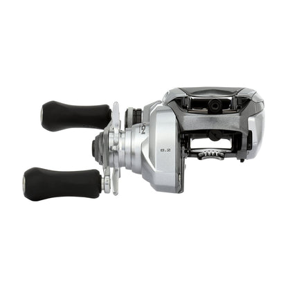 A Shimano Tranx 150A Casting Reel 8.2:1 Right Hand (TRX150XGA), silver with two black handles, is shown against a white background. Designed for saltwater fishing by Shimano.