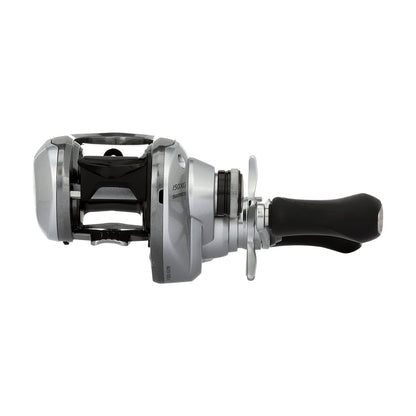 The Shimano Tranx 150A Casting Reel 8.2:1 Right Hand (TRX150XGA) features a silver and black design, large ergonomic handle, front drag adjustment, and open spool—ideal for saltwater fishing—shown against a white background.