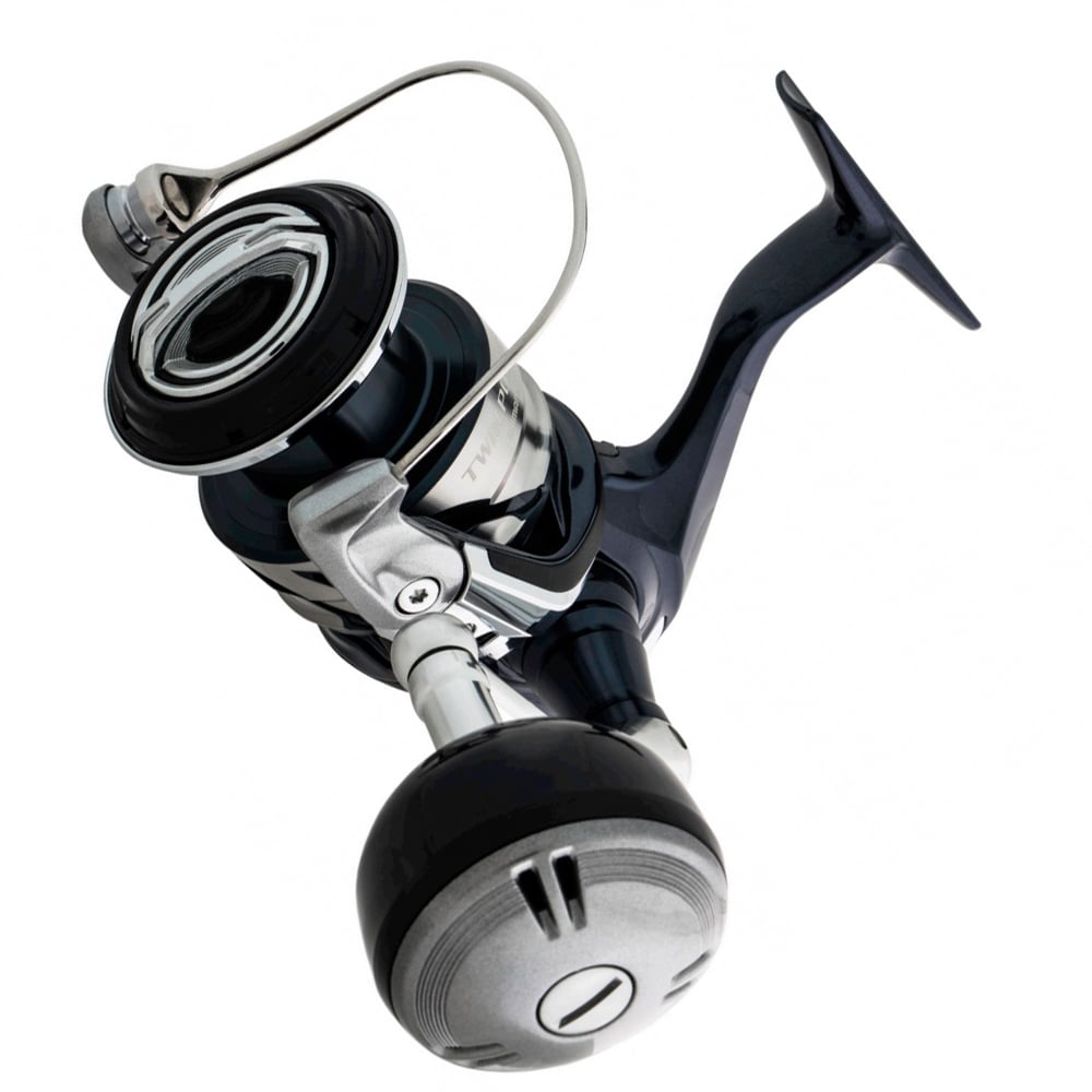 A close-up of the Shimano Twin Power SW Spinning Reel 4000XGC 6.2:1 (TPSW4000XGC) in black and silver, designed for offshore game fish, shown against a white background.