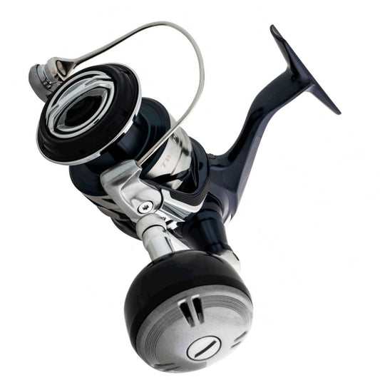 A close-up of the Shimano Twin Power SW Spinning Reel 5000HGC 5.7:1 (TPSW5000HGC) by Shimano, showing its large handle from a low angle against a white background—ideal for offshore game fishing.