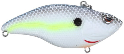 The SPRO Aruku Shad Lipless Crankbaits mimic a fish with a silver and white scale pattern, highlighted by a yellow stripe, black gill dot, and red mouth accent. It includes sturdy metal loops for line attachment and sharp Gamakatsu treble hooks.