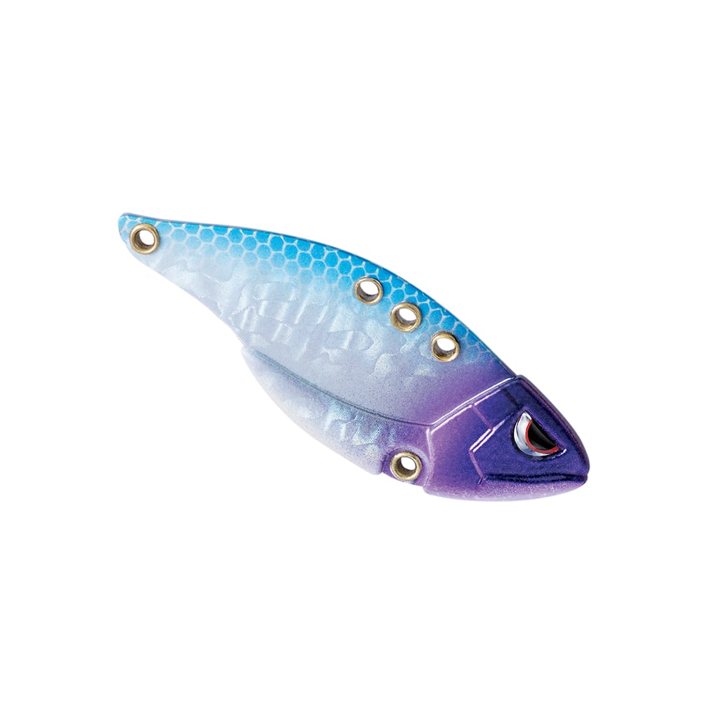The SPRO Carbon Blade TG Blade Bait is a vibrant fishing lure designed for bass anglers and cold water fishing. It showcases a gradient design that transitions from light blue to purple with a metallic finish, featuring several holes along the top edge. The front of the lure is shaped like a fish head, complete with eye detail.
