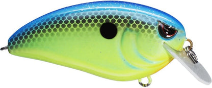 The Spro Fat John 60 Crankbait by SPRO is a vibrant fishing lure with a blue-green gradient, scale-like patterns, and a central black spot. It includes Gamakatsu treble hooks and a clear plastic lip for shallow diving, making it ideal for attracting fish.