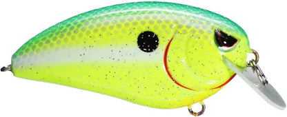 The SPRO Fat John 60 Crankbait is a vibrant, fish-shaped lure with green, yellow, and white scales. It has a black eye spot, red gill details, and a shiny metal fin. Outfitted with Gamakatsu treble hooks, this shallow diving bait ensures enticing performance.