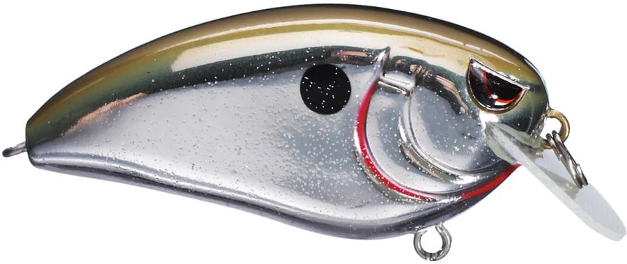 The SPRO Fat John 60 Crankbait is a shiny silver and gold fishing lure with Gamakatsu treble hooks, featuring a black dot near the head, red eye detailing, and a clear lip for shallow dives. Two metal rings allow easy line and hook attachment.