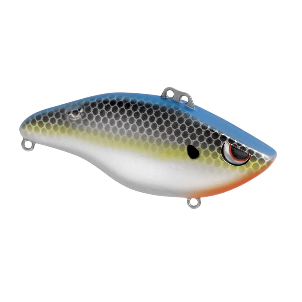The SPRO Wameku Shad Lipless Crankbait features a blue top, silver body, yellow stripe, orange spot near the head, a fish-scale pattern, and a realistic eye.