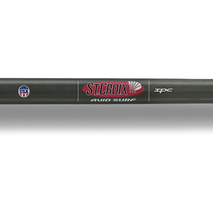 Close-up of a St. Croix Avid Surf Spinning Rod 8’0” Medium (VSS80MMF) with the St. Croix logo, "AVID SURF" text, IPC label, "Made in USA" emblem, Fuji K-Series guides, and Medium power on a dark background.