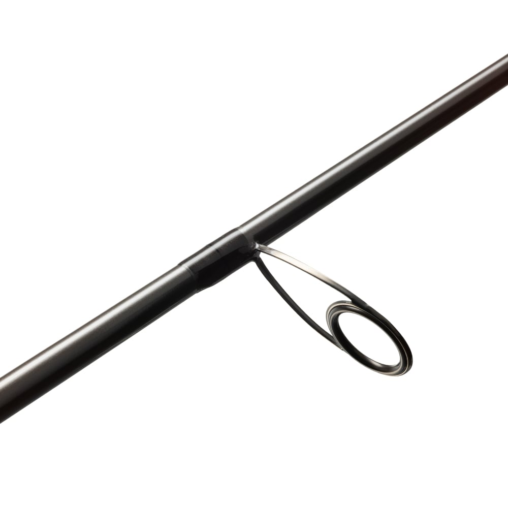 A close-up of the St. Croix Avid Trek Travel Spinning Rod 7'0” Medium Heavy (ATS70MHF3), crafted from SCIII carbon, showing a single metal guide ring on the black rod.