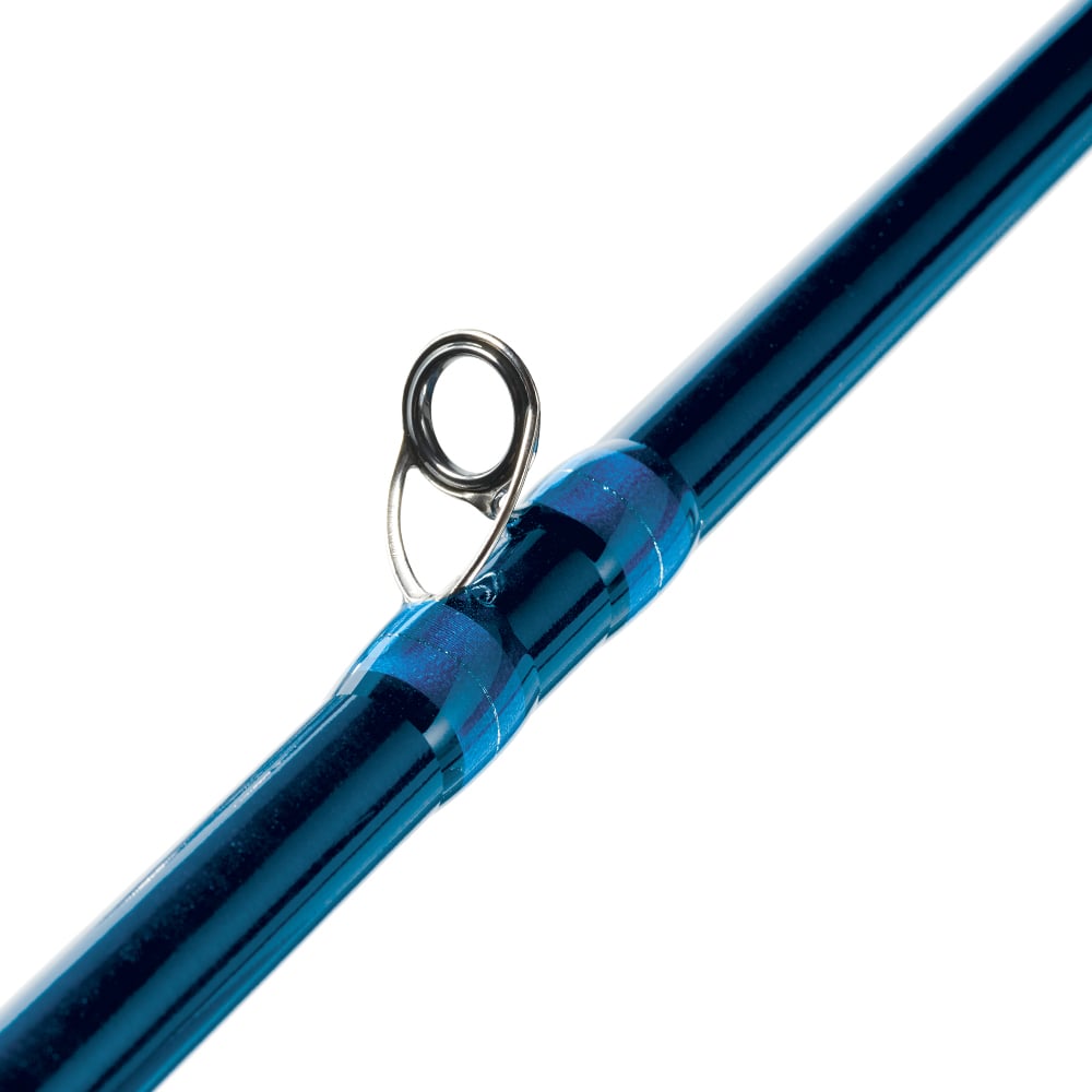 A close-up of the St. Croix Legend Surf Casting Rod (11'0" Medium Heavy 2 Piece | GSC110MHMF2) highlights sleek Fuji® K-Series KW guides with a glossy finish, beautifully connected by blue wrappings against a plain white background to emphasize its craftsmanship.