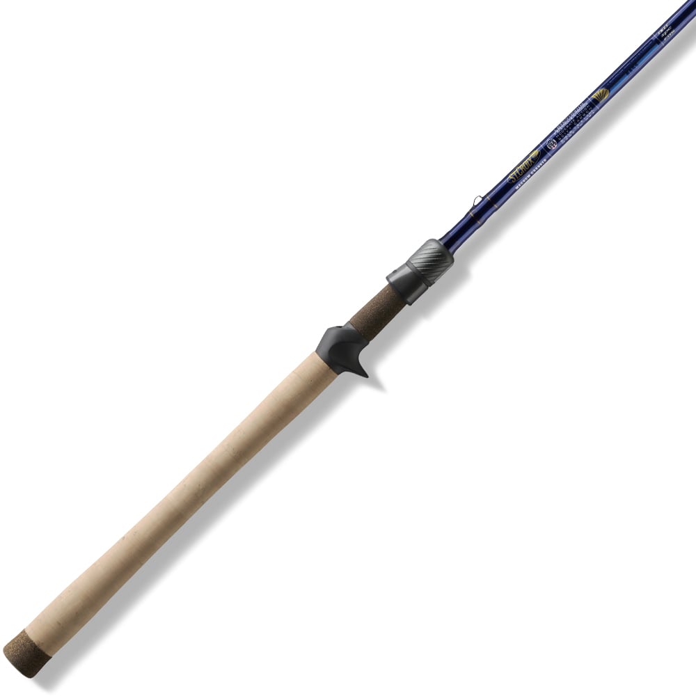 The St. Croix Legend Tournament Bass Casting Rod 7'11" Heavy Power Flip'n (LBTC711HMF) features a long, light cork handle, black reel seat, and blue shaft shown diagonally on a white background.