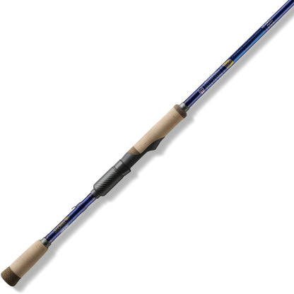 The St. Croix Legend Tournament Bass Spinning Rod 7'1" Medium Versatile is made from SCIV+ Carbon Fiber and features cork handles, a metallic reel seat, and guide rings. It's diagonally displayed against a white background.
